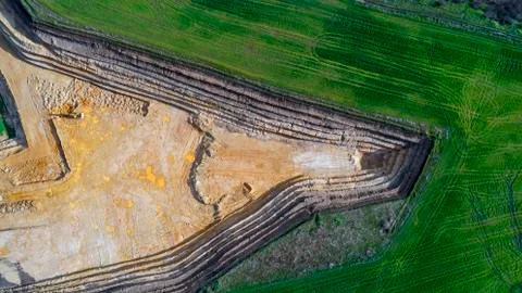 Panoramic view of sand quarry, mining of yellow construction sand, pumping sand  Stock Photos