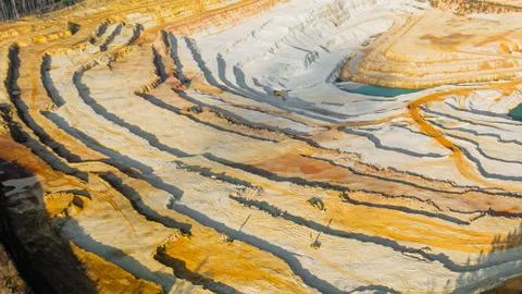 Panoramic view on a sandpit. Mining of ore and natural resources. Top view on Stock Photos