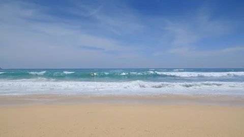 Panoramic view from sandy beach with huge waves and and clear blue water Video stock 114988775