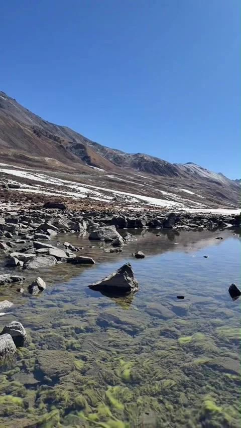 Panoramic View of Sapu Holy Mountain and Glacial Lake Stock Footage 330097203