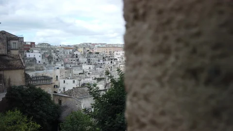 Panoramic view of the SASSI DI MATERA from behind a wall Stock Footage 165099348