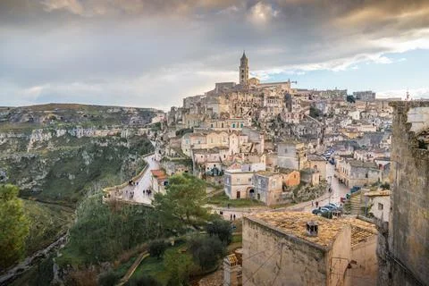 Panoramic view of Sassi of Matera, stone city at sunset, Basilicata, Italy Stock Photos
