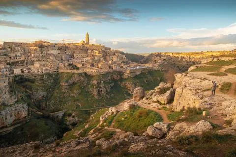 Panoramic view of Sassi of Matera, stone city at sunset, Basilicata, Italy Stock Photos