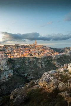 Panoramic view of Sassi of Matera, stone city at sunset, Basilicata, Italy Stock Photos