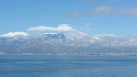 Panoramic view of the sea and the mountain range on cloudy weather 動画素材 239630873