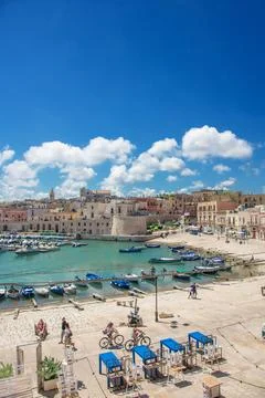 Panoramic view of seafront and old town Bisceglie in Puglia on sunset. Stock Photos