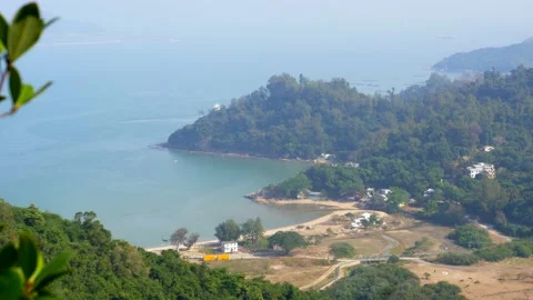 A panoramic view on the seascape, clean sand and green woods in the background Stock Footage 144044117
