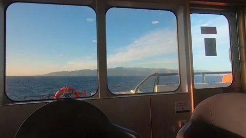 Panoramic view from the seats inside a passenger ship, La Gomera island in front Stock Footage 169874571