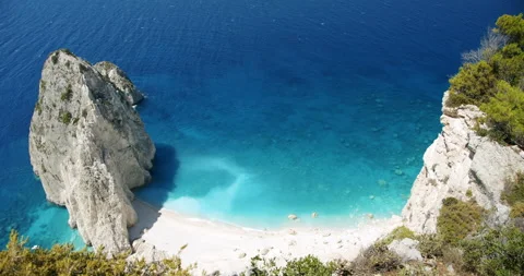 Panoramic view of secluded beach with white rock formation near Keri with blue Video stock 140250264