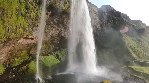 Panoramic view of Seljalandsfoss waterfall with sun flare, Iceland Stock Footage 334793542