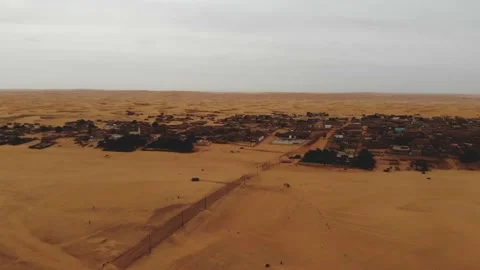 Panoramic view of a settlement in Mauritania. settlement in Mauritania. Settl Stock Footage 137492904