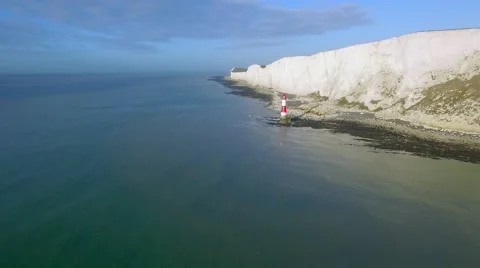 Panoramic view of Seven Sisters cliffs with lighthouse and sea Stock Footage 59954488