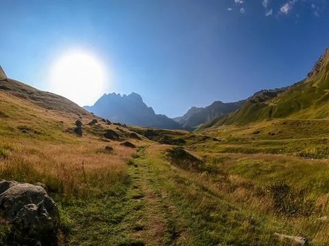 A panoramic view on the sharp mountain peaks of the Chaukhi massif in the G.. Stock Photos