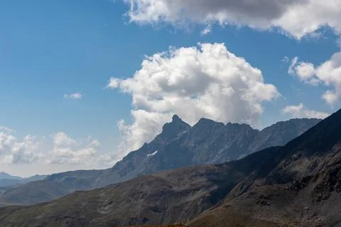 A panoramic view on the sharp ridges of the mountain peaks of the Chaukhi m.. Stock Photos