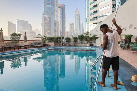 Panoramic view of Sheikh Zayed road, high-rise towers and swimming pool. Black Stock Photos