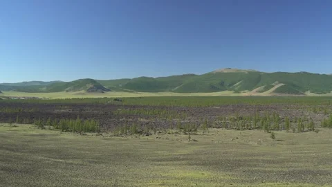 Panoramic view shows basalt plain - Ecological Succession and Landscape Texture Stock Footage 339703650