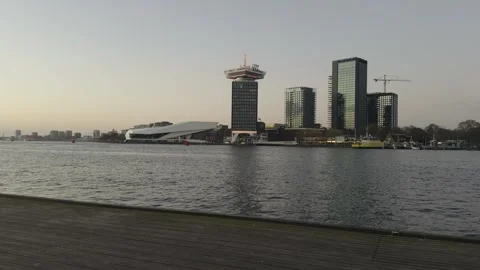 A panoramic view shows the A'DAM Toren and the EYE Film Institute Stock Footage 332177695