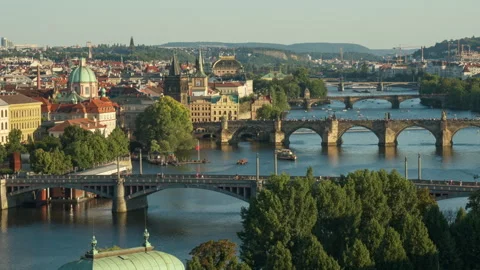 Panoramic view shows Vltava river and historic stone bridges in Prague city. Vídeos de archivo 342024518