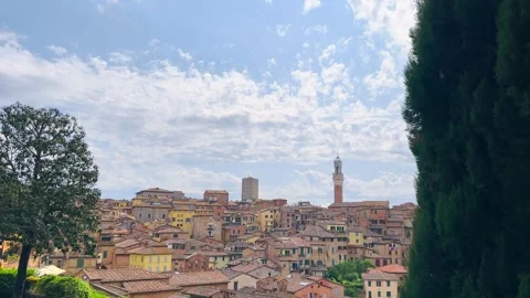 Panoramic view of Siena skyline with tower Torre di Mangia tower and colorful Stock Footage 345150485