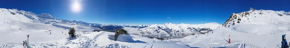 Panoramic view on ski slopes Stock Photos