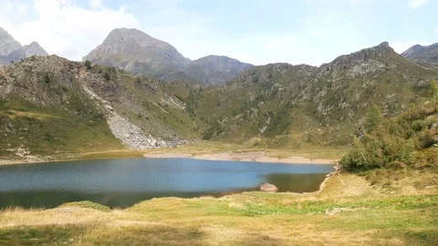 Panoramic view of small alpine lake on the Bergamo Alps. Stock Footage 79655411
