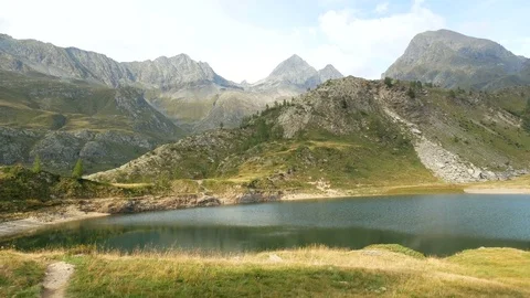 Panoramic view of small alpine lake on the Bergamo Alps. 스톡 동영상 79655504