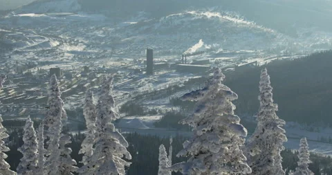 Panoramic view of a small Siberian mountain village in a snowy hills and white Stock Footage 144169554