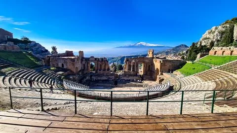 Panoramic view of snow capped Mount Etna volcano on a sunny day seen from t.. Stock Photos