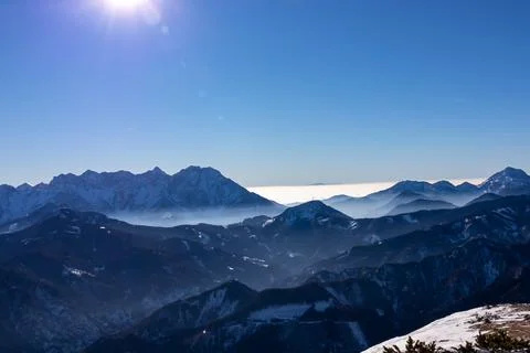 Panoramic view on snow capped mountain peaks of Karawanks in Carinthia, Aus.. Stock Photos