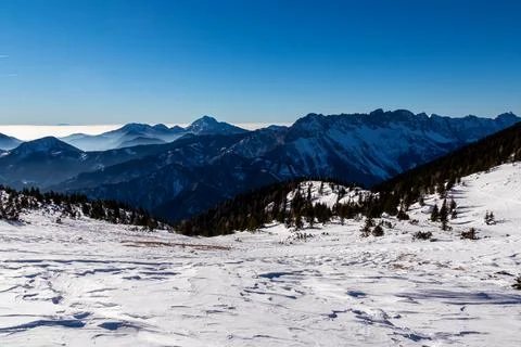 Panoramic view on snow capped mountain peaks of Karawanks in Carinthia, Aus.. Stock Photos