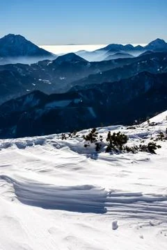 Panoramic view on snow capped mountain peaks of Karawanks in Carinthia, Aus.. Stock Photos