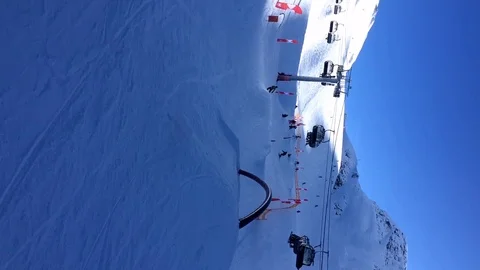 Panoramic view of the snow-capped mountains and the cable car. Stock Footage 123305564