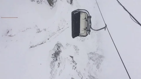 Panoramic view of the snow-capped mountains and the cable car. Vertical video Stock Footage 123306277
