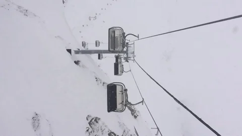 Panoramic view of the snow-capped mountains and the cable car. Vertical video Stock Footage 123306378