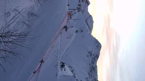 Panoramic view of snow-capped mountains and sunset Stock Footage 123306386