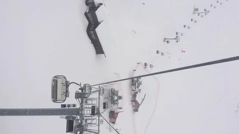Panoramic view of the snow-capped mountains and the cable car. Vertical video Stock Footage 123307507