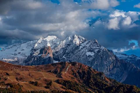 Panoramic view of snow-capped mountains in the Dolomites in Italy. Stock Photos