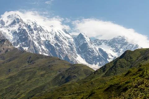A panoramic view on the snow-capped peak of Jangi-Tau(Dzhangi-Tau) in the G.. Stock Photos
