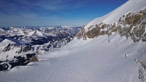 Panoramic view of the snow-covered Alpine mountains on a sunny. Stock Footage 303445146