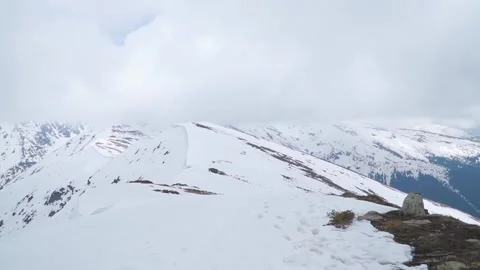 Panoramic view of snow covered ridge and mountain terrain of Romania. Video stock 247178059
