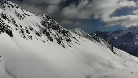 Panoramic view of snowcapped mountain range Stock Footage 240255513