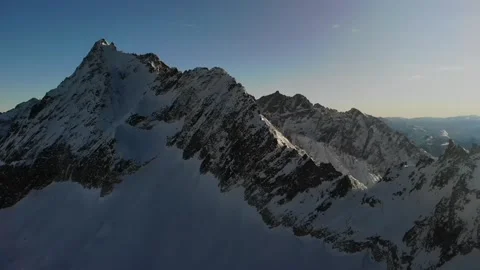 Panoramic view of snowcapped mountain range Stock Footage 240262083