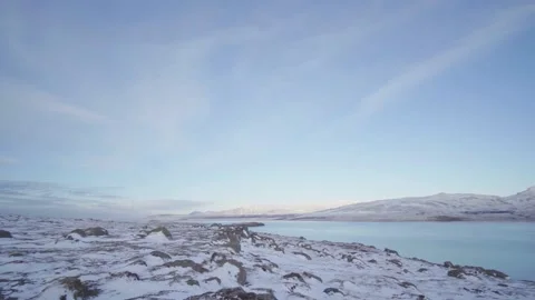 Panoramic view of the snowy fields and mountains beside the river in Iceland Video stock 155271467