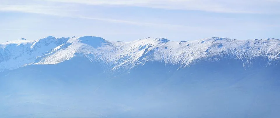 Panoramic view of a snowy mountain range in the distance, copyspace. La Pinilla Stock Photos