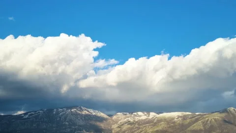 Panoramic view of Snowy winter mountains with clouds motion,cold season weather Stock Footage 232342991