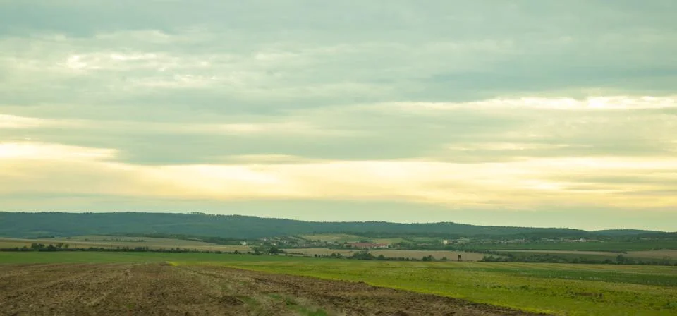 Panoramic view of the spring evening in Austria, hills and mountain slopes in Stock Photos