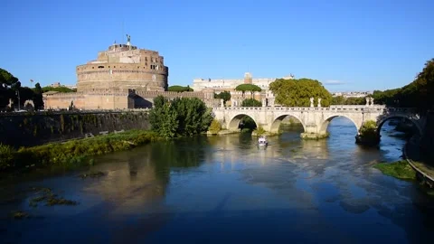 Panoramic view of St. Angel Castle and St. Angel Bridge with tourist boat Stock Footage 163085270