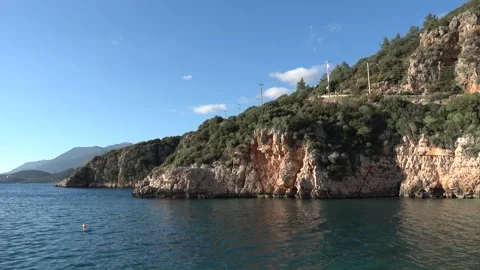 Panoramic view of steep cliffs and mountains by the sea in Kas Видео 332860965