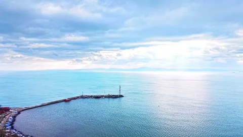 Panoramic view of a stone pier and lighthouse tower, Bulgaria Video stock 341764350