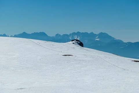 Panoramic view on summit cross of mountain peak Grosser Sauofen in winter o.. Stock Photos